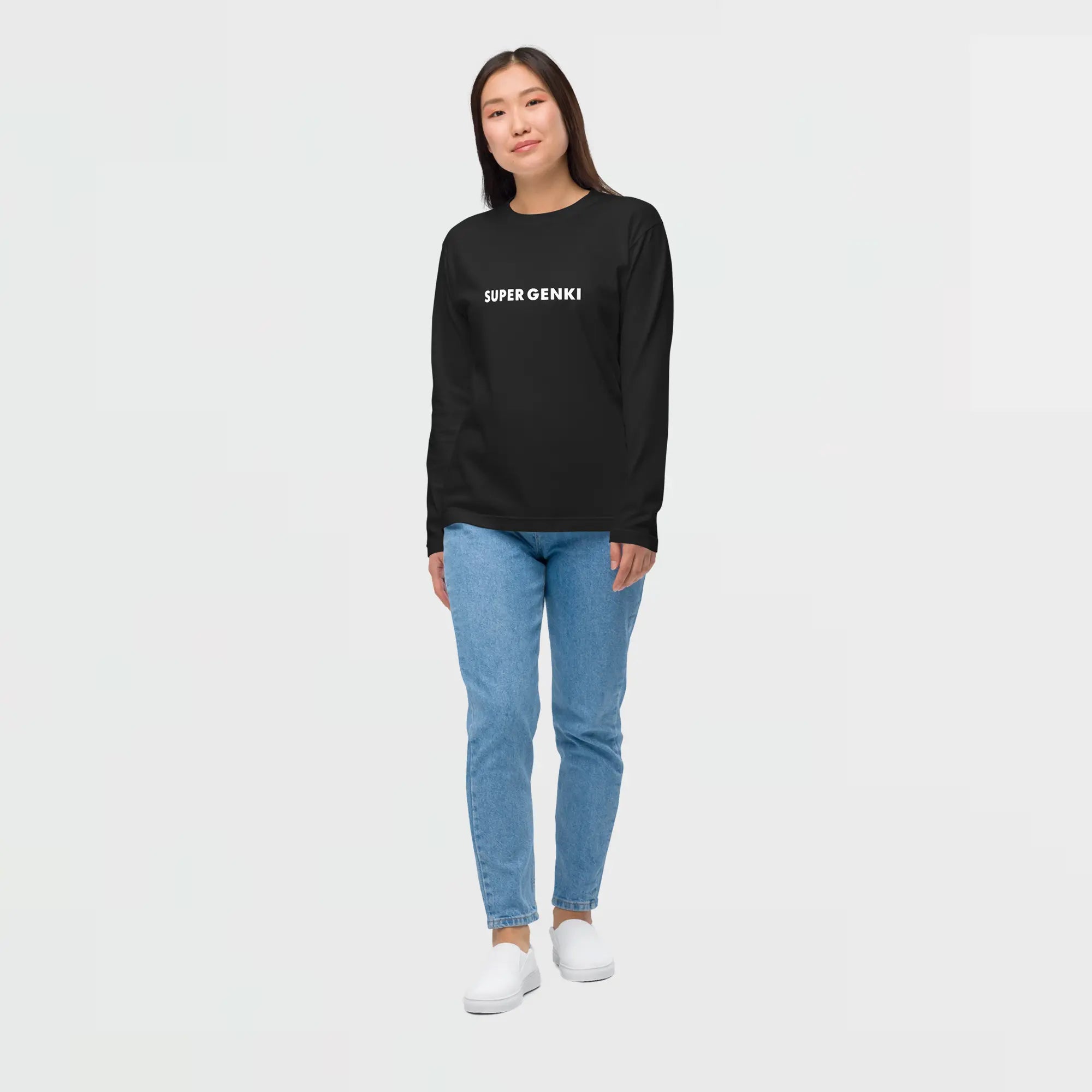 Lady wearing a black Super Genki Long Sleeve T-shirt with 'Super Genki' text on the front